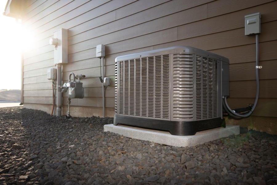 Comfort Central technician servicing residential heating equipment